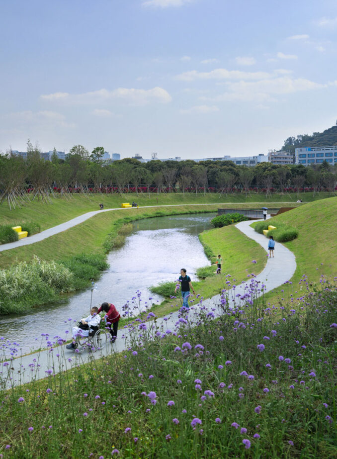 Revitalizing the Landscape near Sun Yat-Sen University - View along river and waterway with people in wheelchair on a path